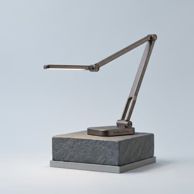Adjustable LED desk lamp on a stone base